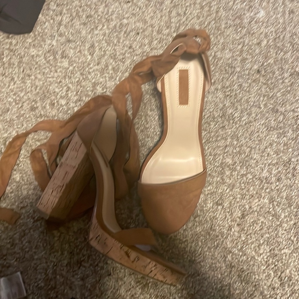 Brown heels that tie around the ankle, never worn.